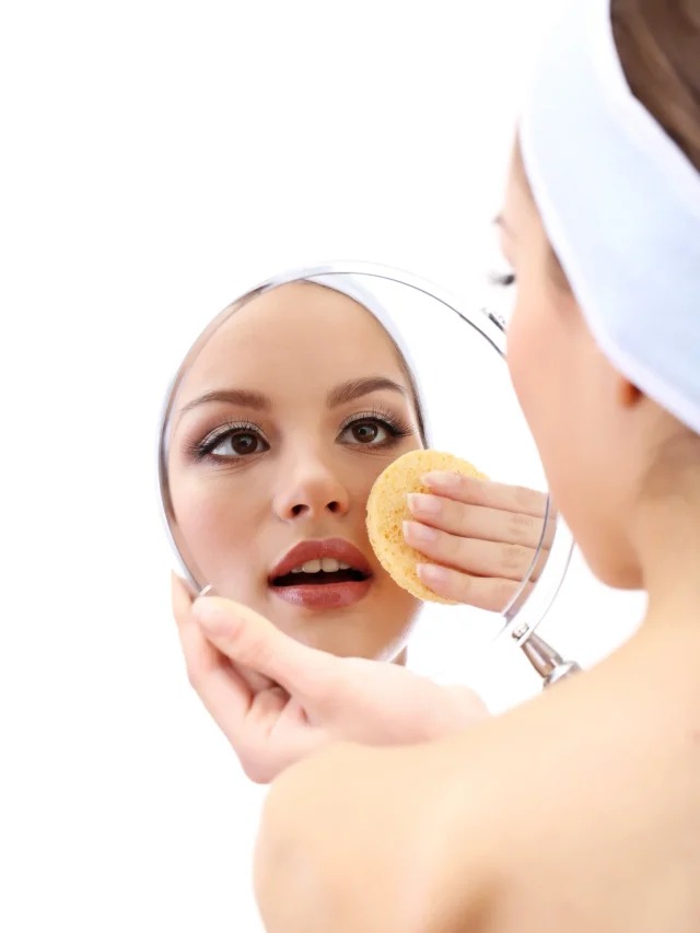 young-woman-cleansing-her-face-isolated-white